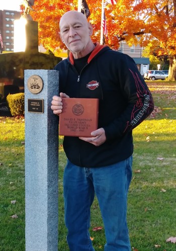 Retired NYPD Detective Ralph Friedman holds the brick that he purchased to honor his father, Technician 4th Grade David Friedman, who served in the European Theater of Operations during WWII.  The brick was placed in the walkway for Veterans Day 2018.