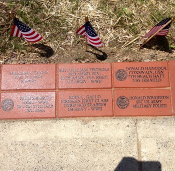 Close up view of some of the many bricks that are in the Veterans Walkway of Honor.