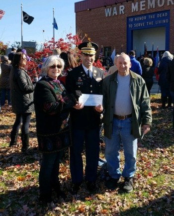 Project Organizer Lee Teicholz and his wife, Mary, present a $1000 check from the brick sale profits to State of Connecticut Department of Veterans Affairs Commissioner Thomas Saadi at the Veterans Day Ceremony on November 11, 2018.  The funds will be utilized for the Veterans Outreach Program.