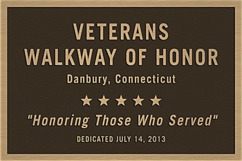 The bronze dedication plaque that marks the beginning of the Veterans Walkway of Honor.